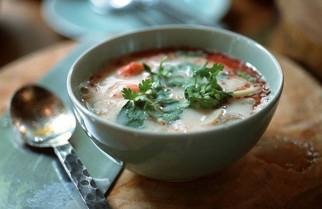 a bowl of soup with a spoon