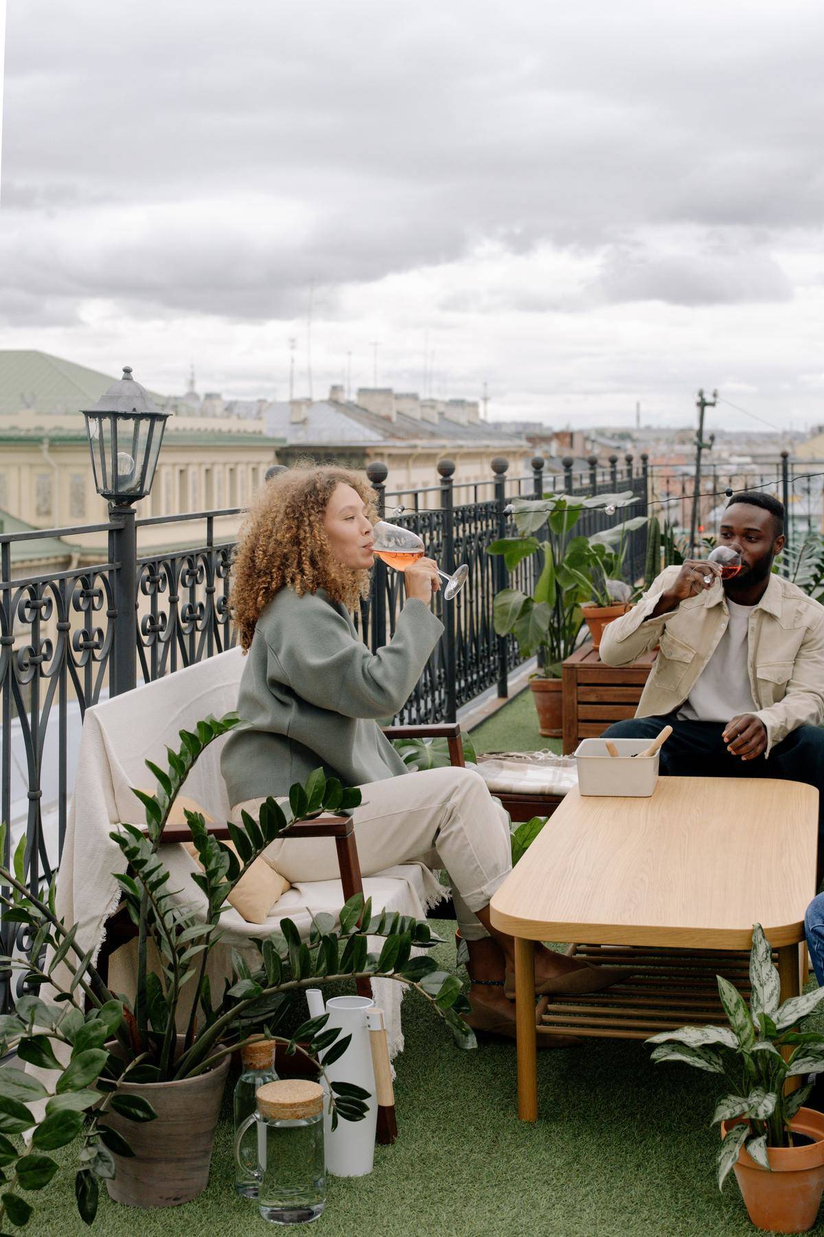 Couple sip wine on rooftop patio