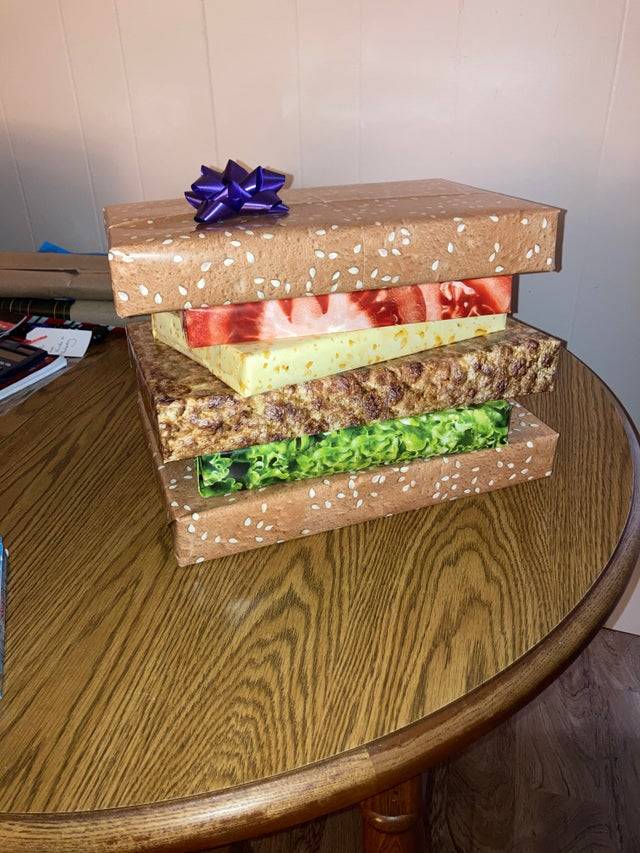 Christmas presents wrapped together that look like a hamburger. 