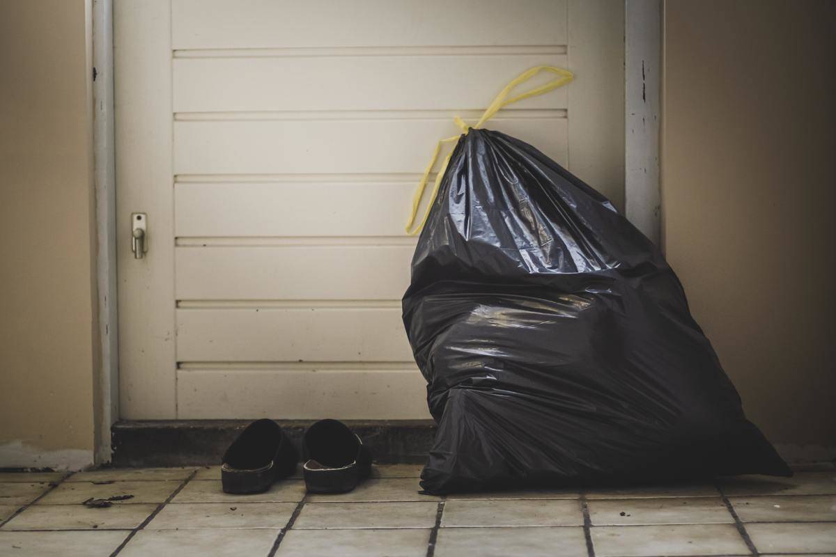 Garbage bag beside the door.