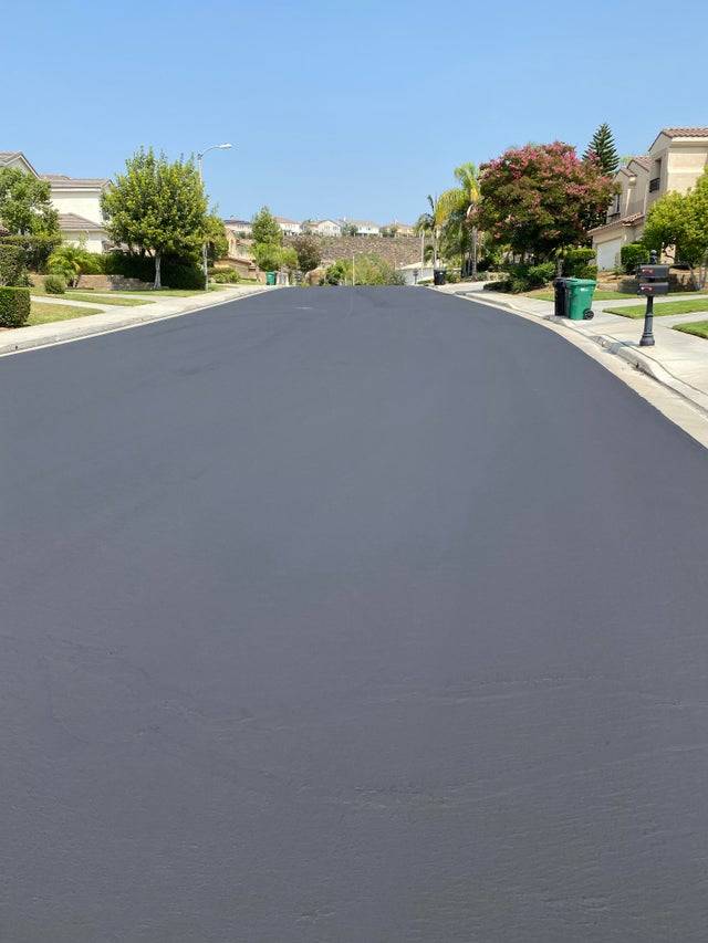 Freshly sealed pavement on residential street