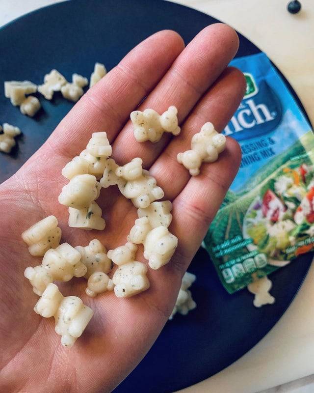 Ranch gummy bears in hand