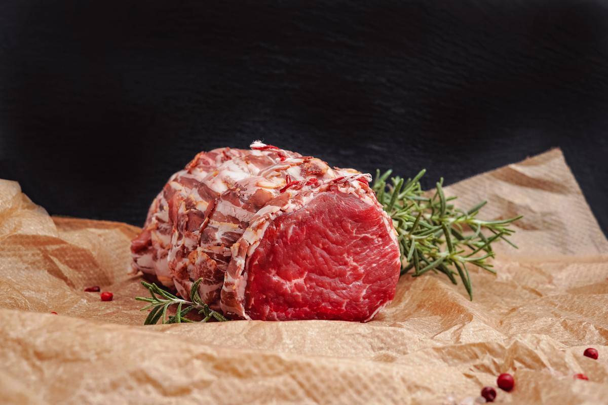 A raw cut of beef tenderloin.