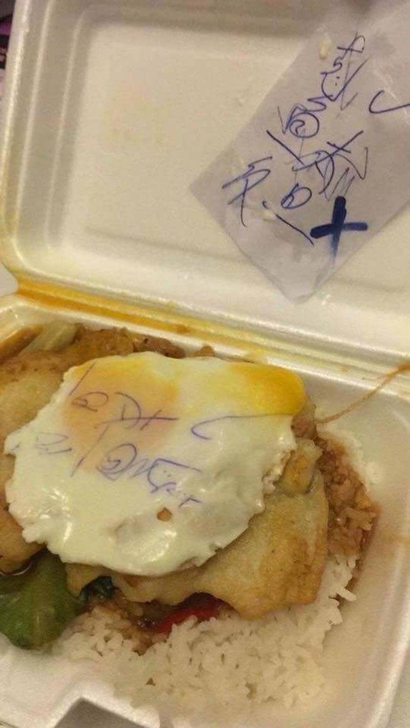 Chinese food takeout written receipt imprinted on egg
