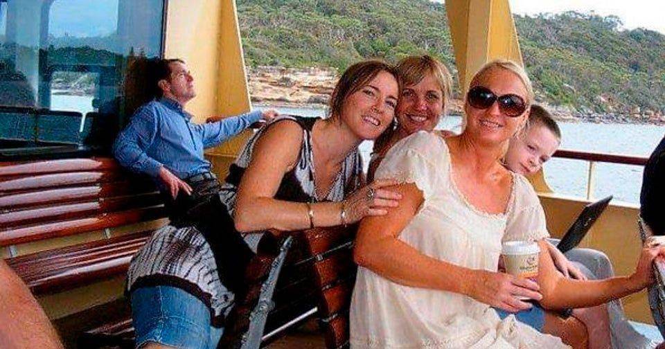 man on boat looks like he's sitting on woman infront of him