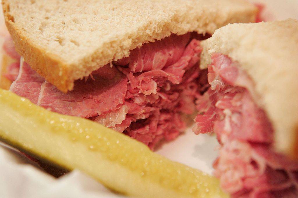 corned beef sandwich with a pickle