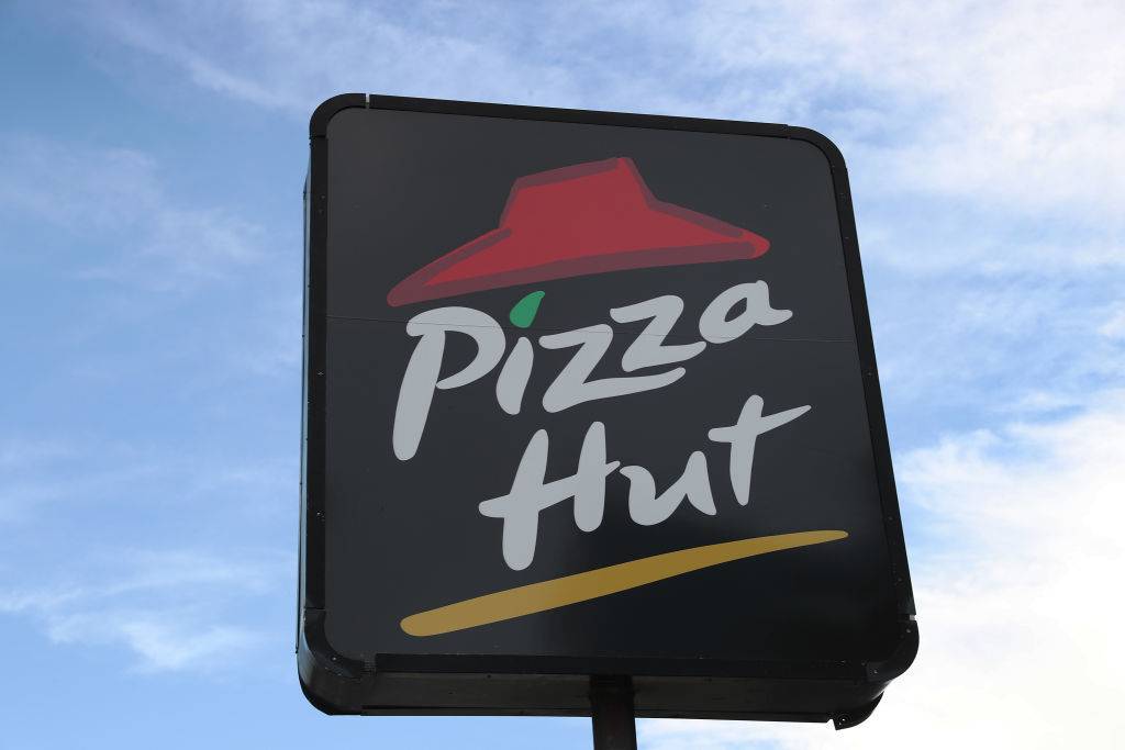 A sign is seen at a Pizza Hut restaurant