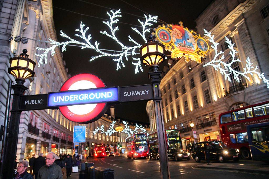 Consumers peruse the shops on Regent Street under the Christmas lights
