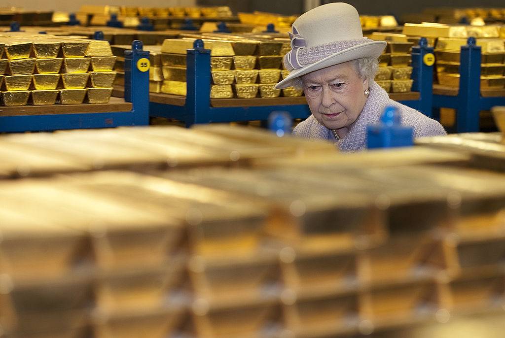 Queen Elizabeth II views stacks of gold