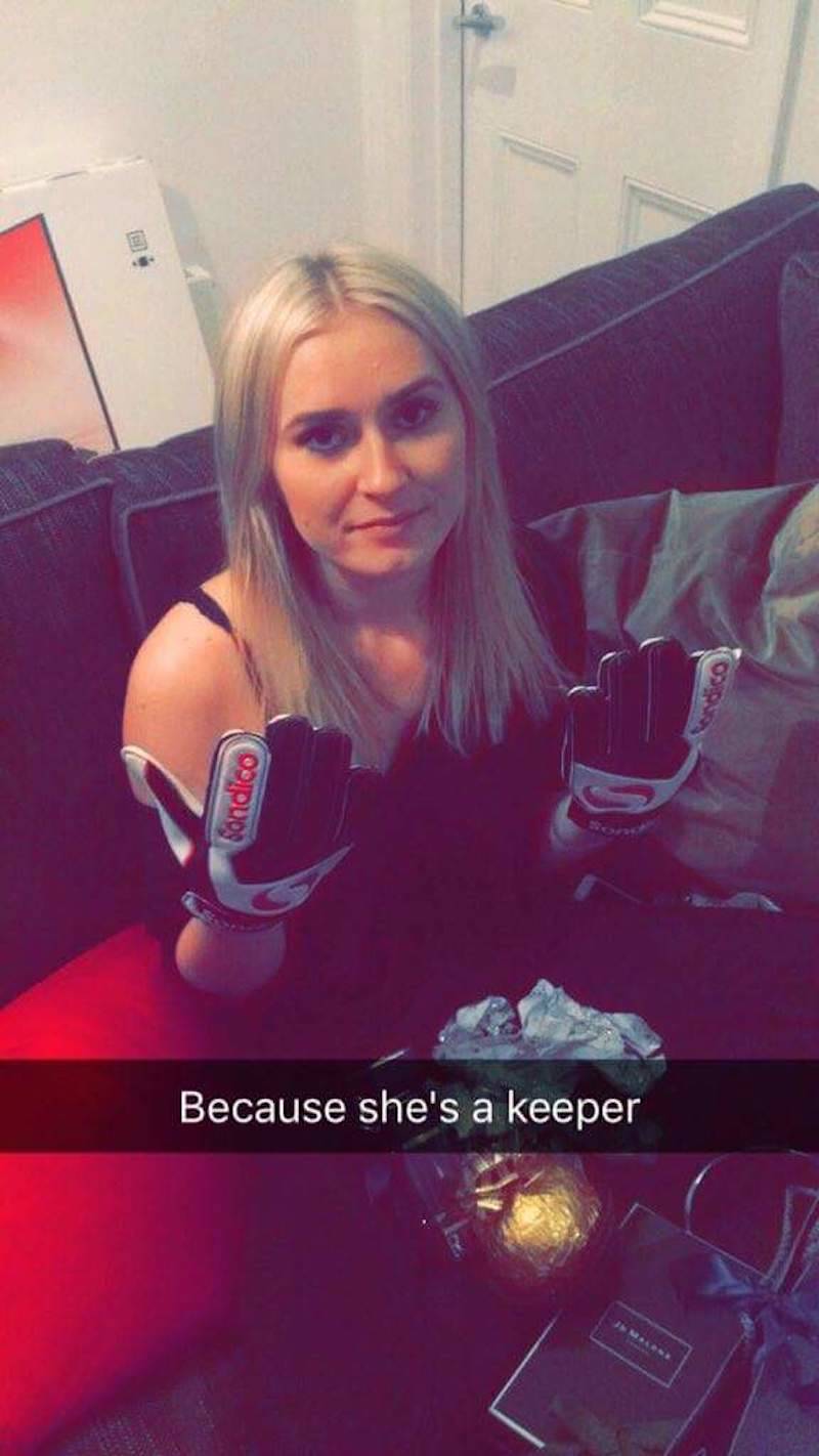 Woman wearing goalie gloves "because she's a keeper"
