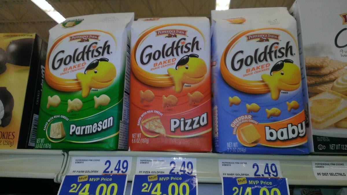 Packages of goldfish on the shelf and one of them is called baby.