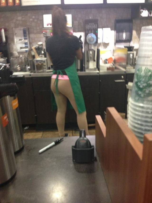 Starbucks barista wearing skin colored leggings.