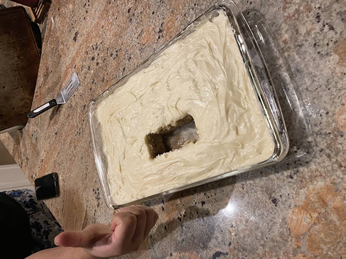 Home-baked cake with piece cut right out of the middle