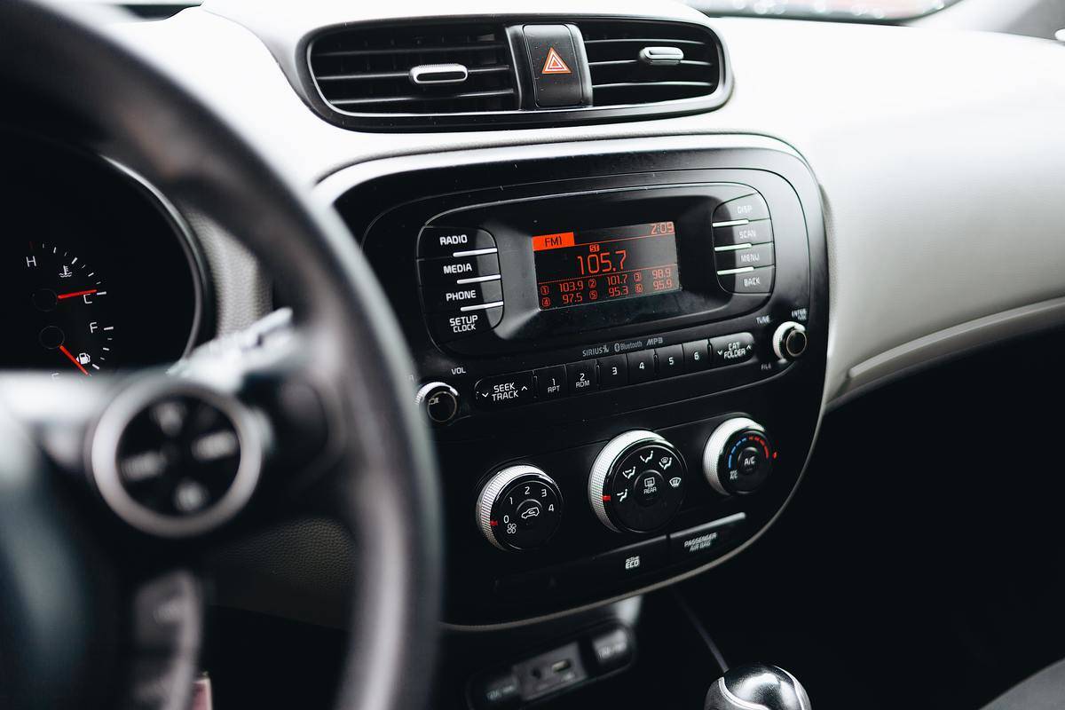 A car stereo with the radio set to 105.7FM.