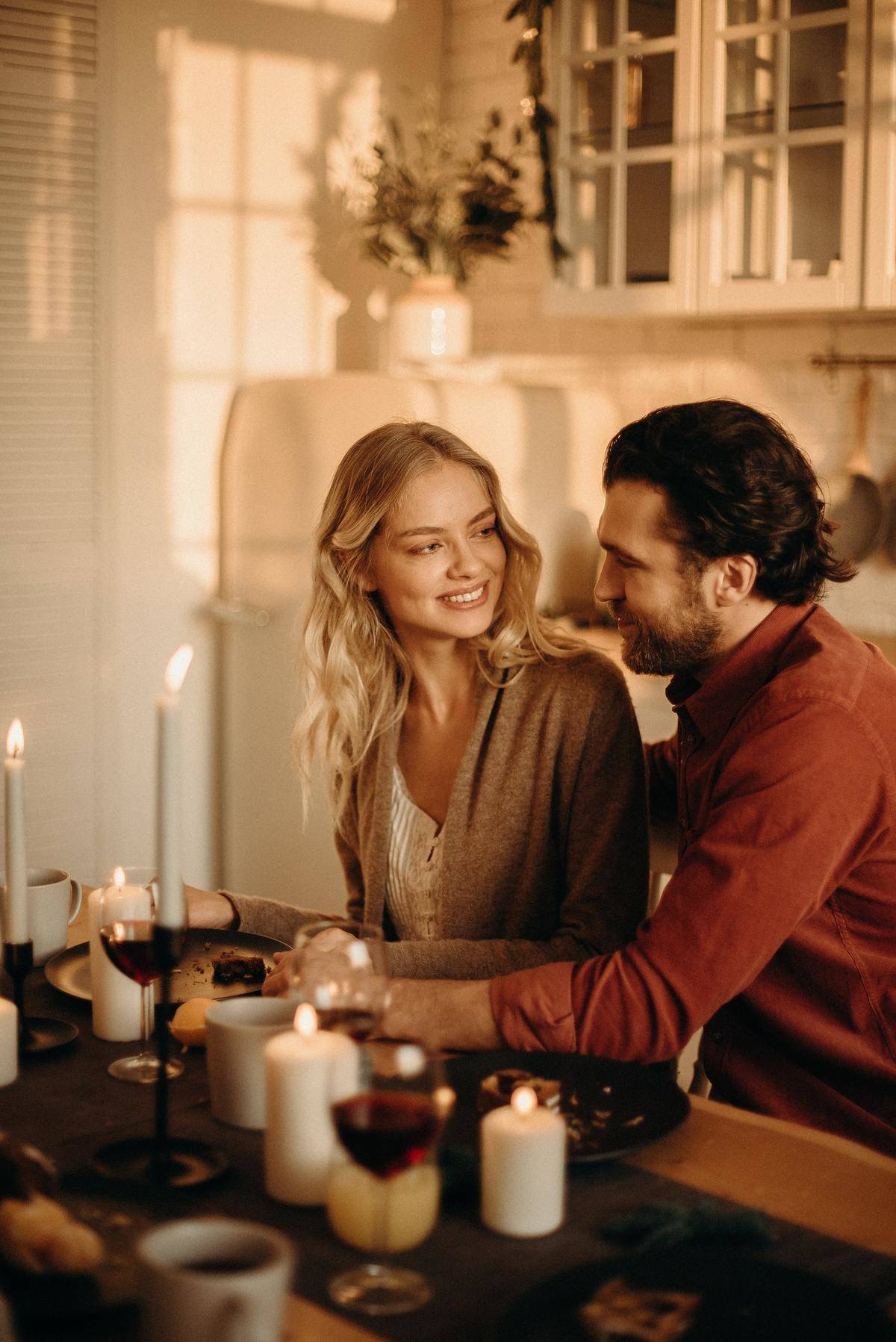 Woman smiling at man on dinner date