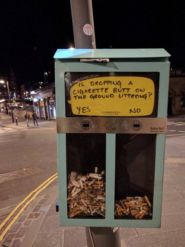 Cigarette butt discard voting system.