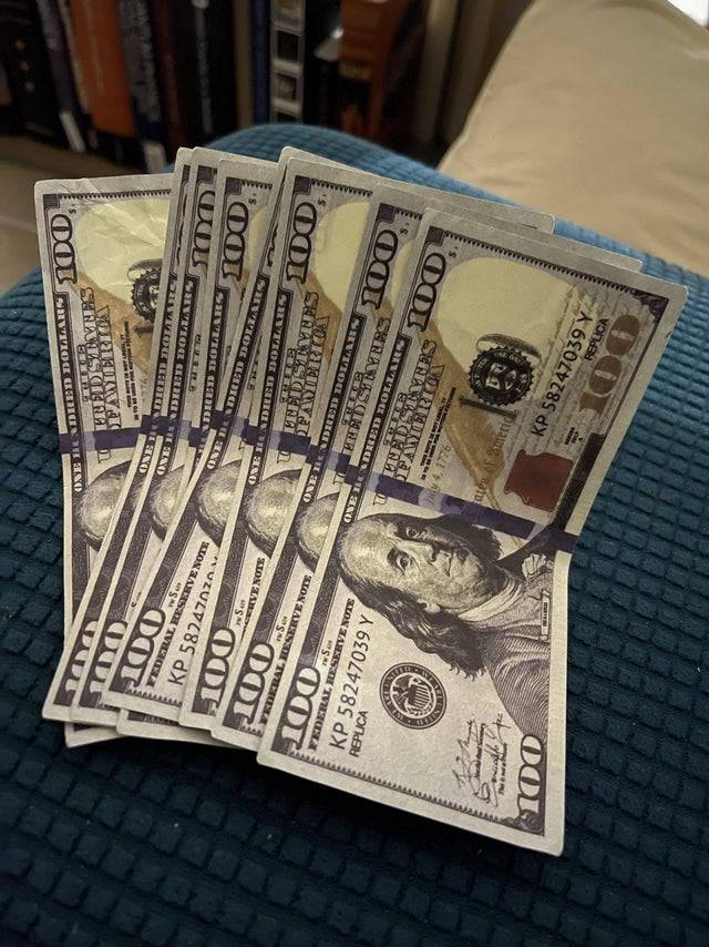 Eight fake $100 bills