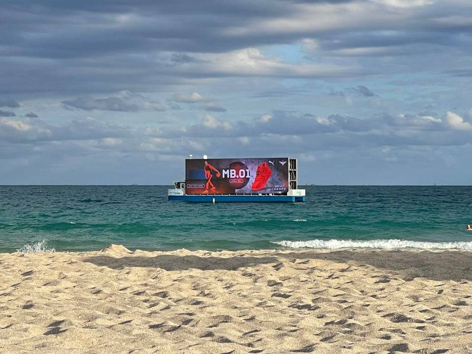 Floating billboard at popular Miami beach tourist area