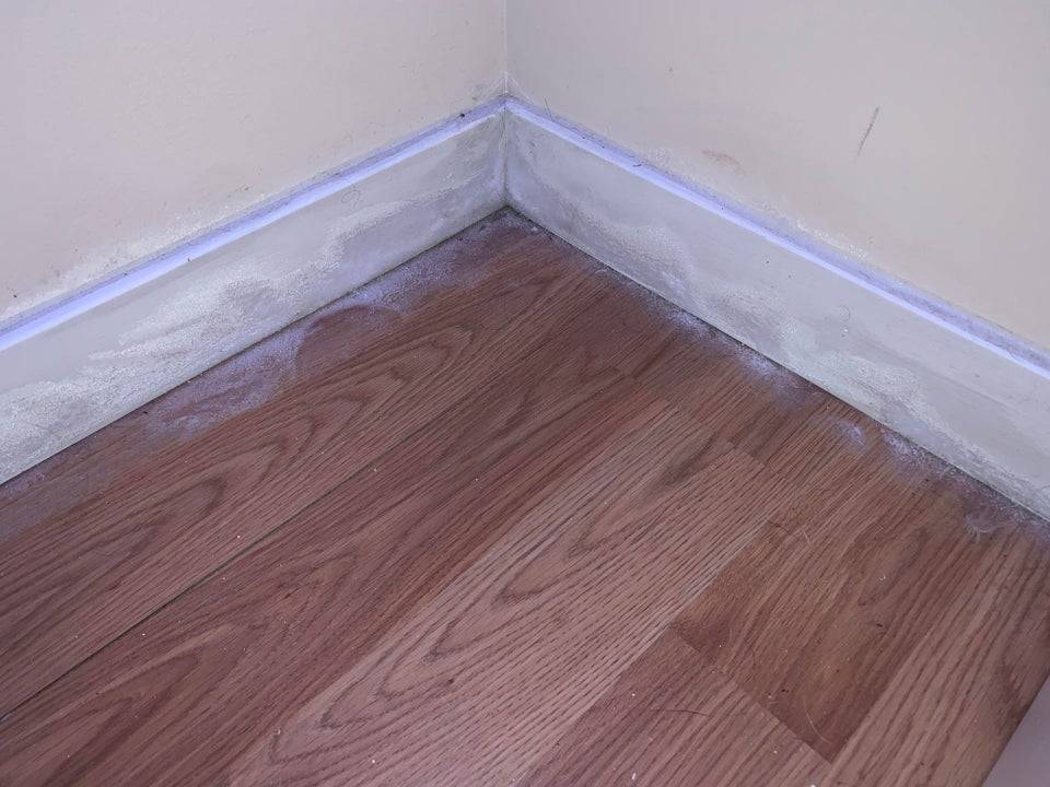 Frost begins to form on the baseboards of a room