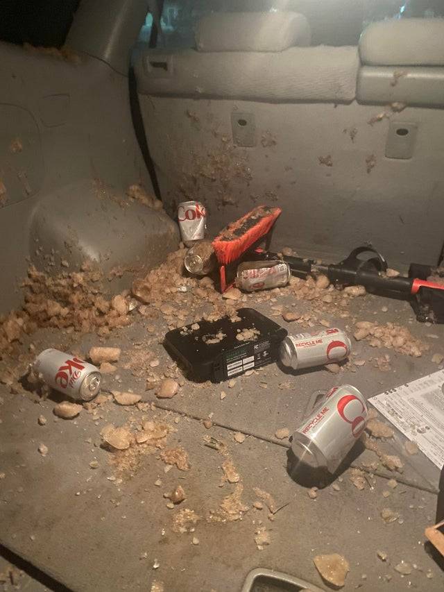 Exploded Diet Coke cans in the back of a car. 