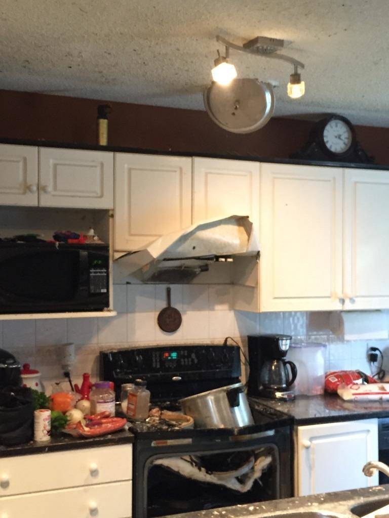 Pressure cooker that has exploded and broken the oven and the cupboards. 
