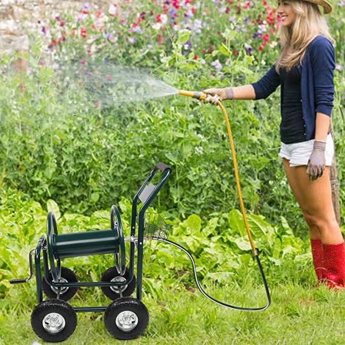 Woman watering flowers with a hose that is not connected to anything