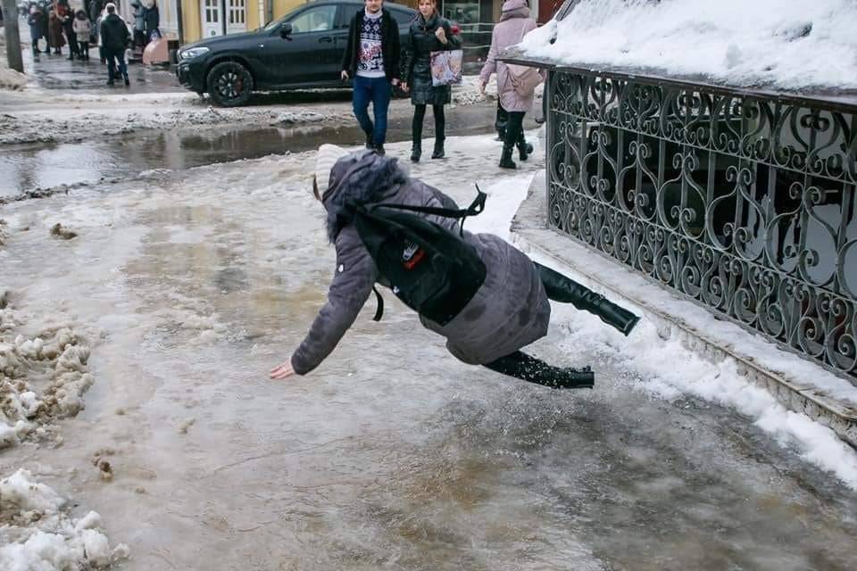 Woman about to fall on ice.