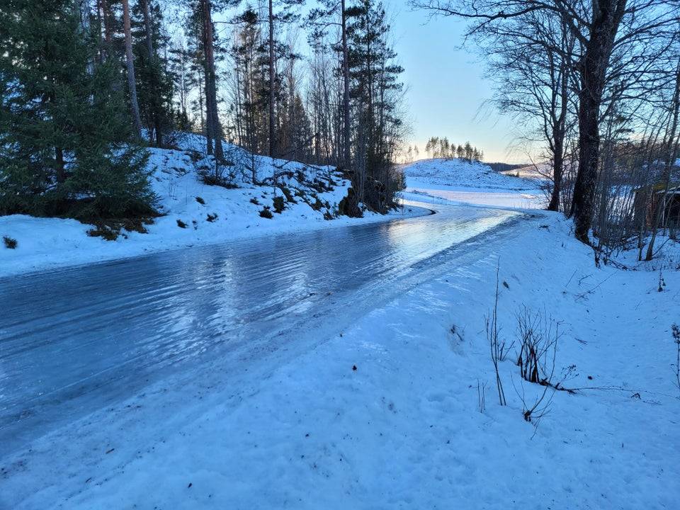 A super icy road out in the wilderness.