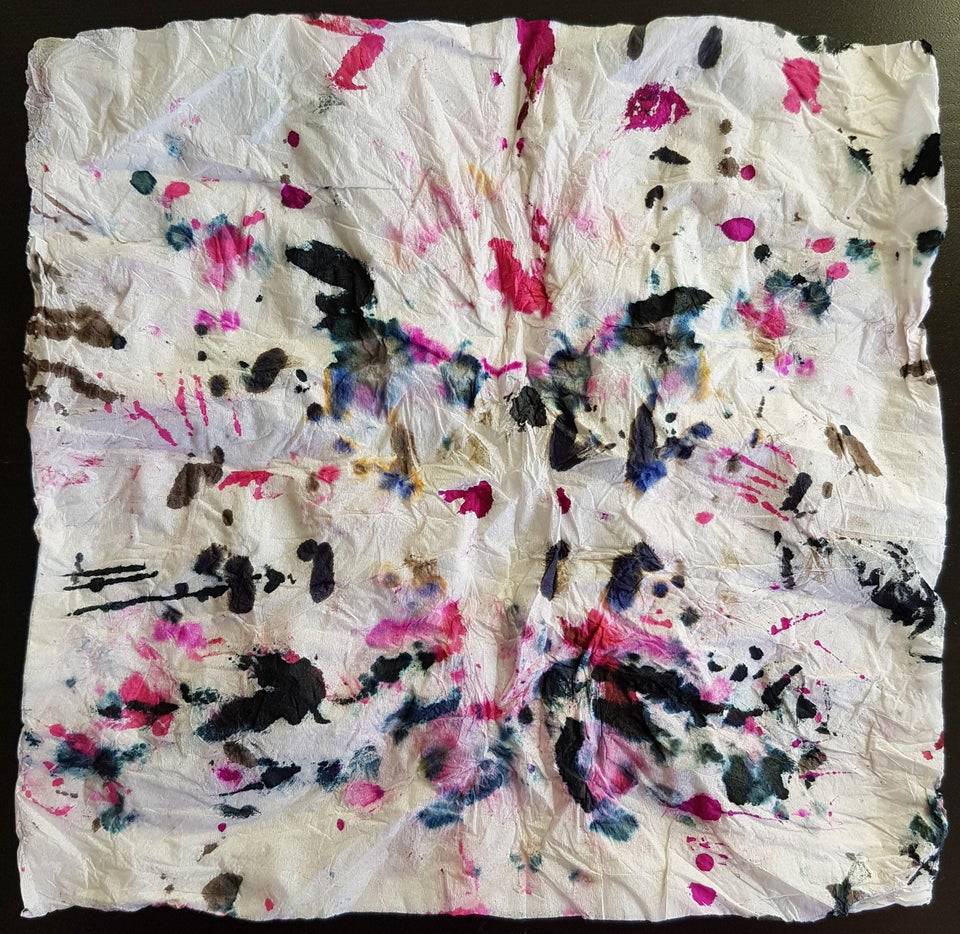 Rag with ink marks all over it. 