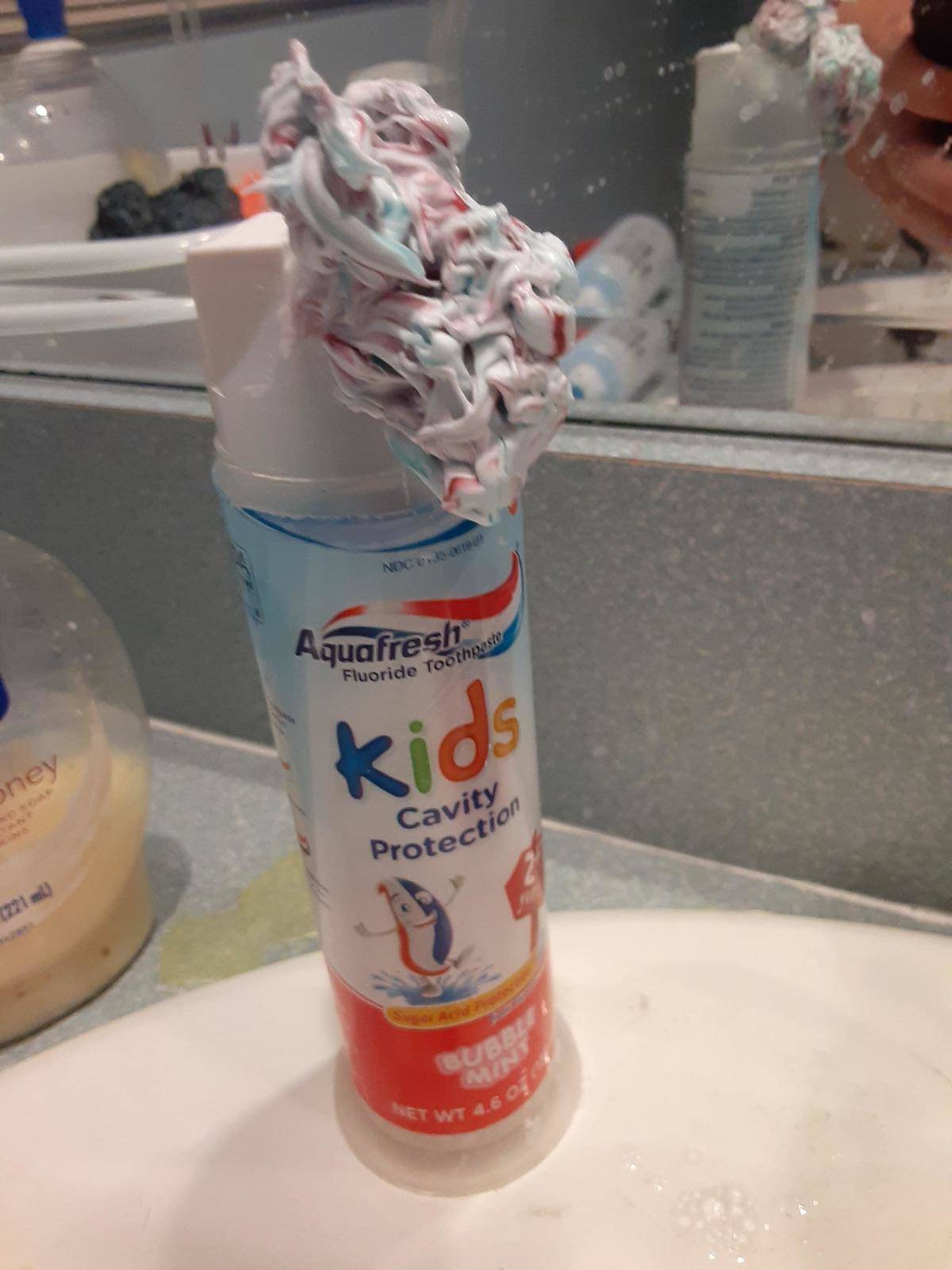 Children's toothpaste overflowing out of container