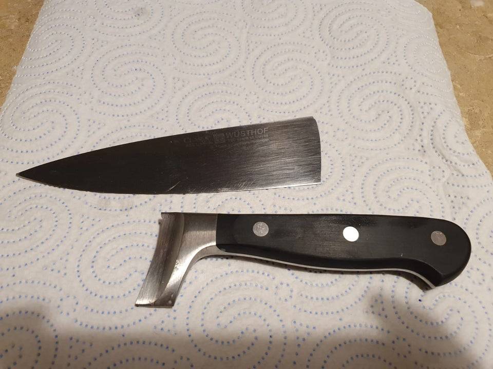 A fancy kitchen knife that's broken in half.