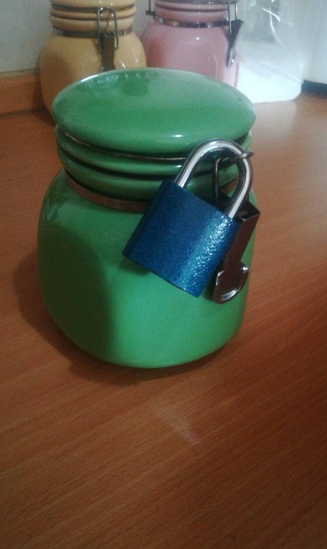 Green coffee jar with a lock on it.