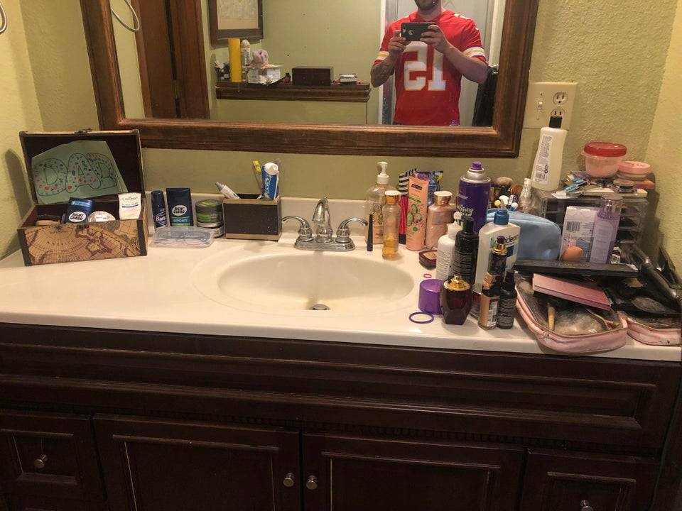 Boyfriend shares photo of cluttered bathroom vanity after his girlfriend moved in.