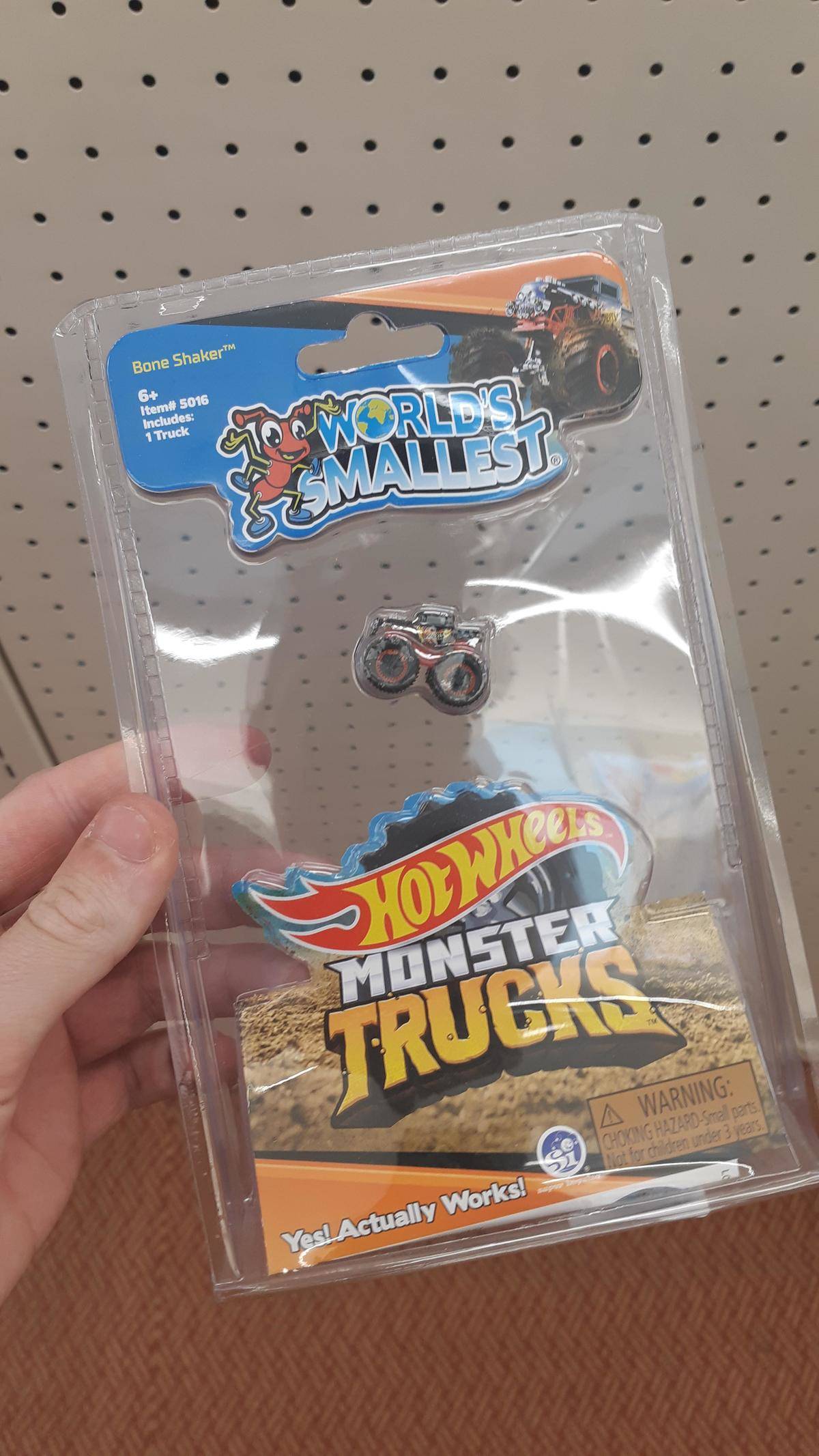 World's tiniest monster truck toy in large plastic package