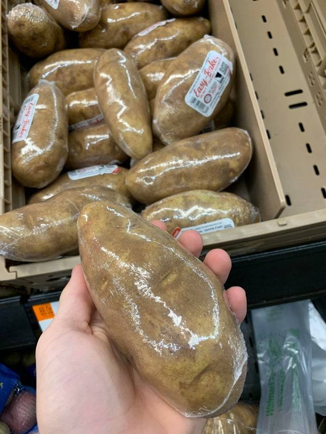 Potato wrapped in plastic wrap for individual sale