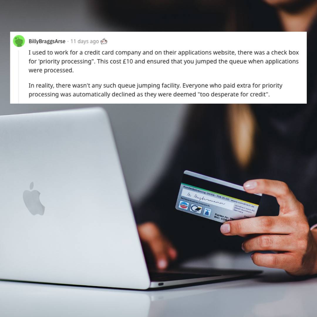 Person at laptop holding a credit card.