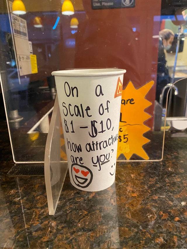 Tip cup asking for money based off rating how attractive you are. 