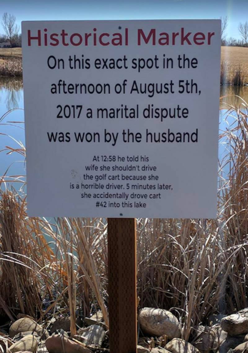 Historical marker sign marking husband and wife's dispute