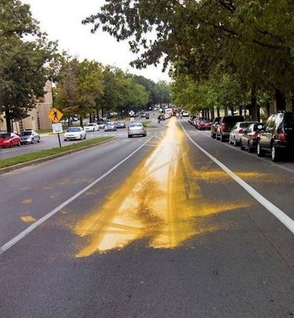 Yellow paint spilled on the road. 