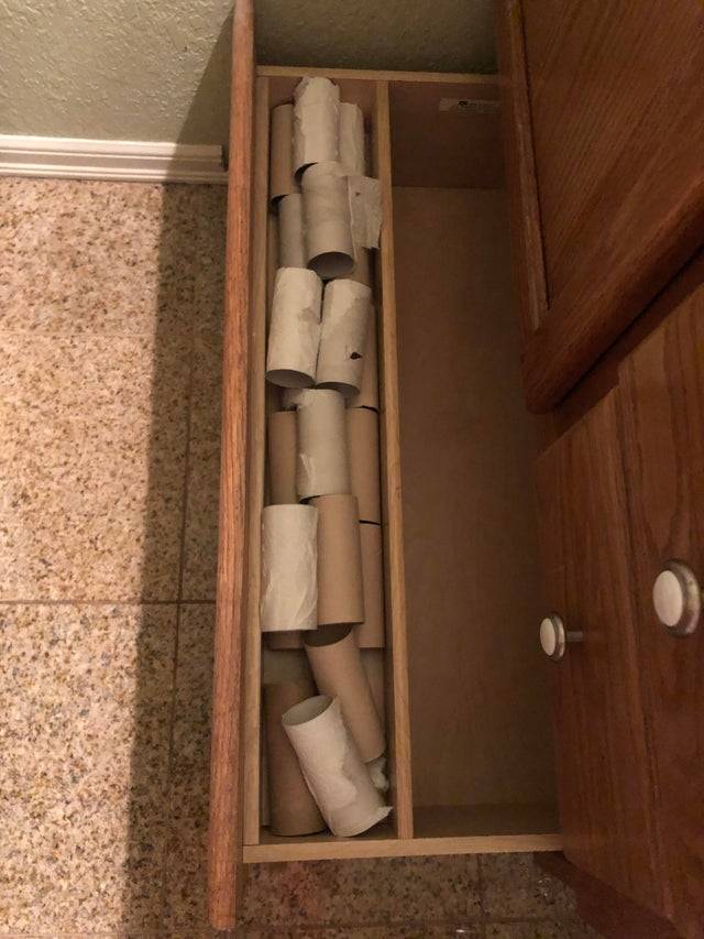 Drawer full of empty toilet paper rolls
