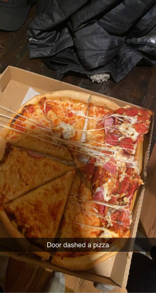 Pizza that the toppings have slid to one side. 