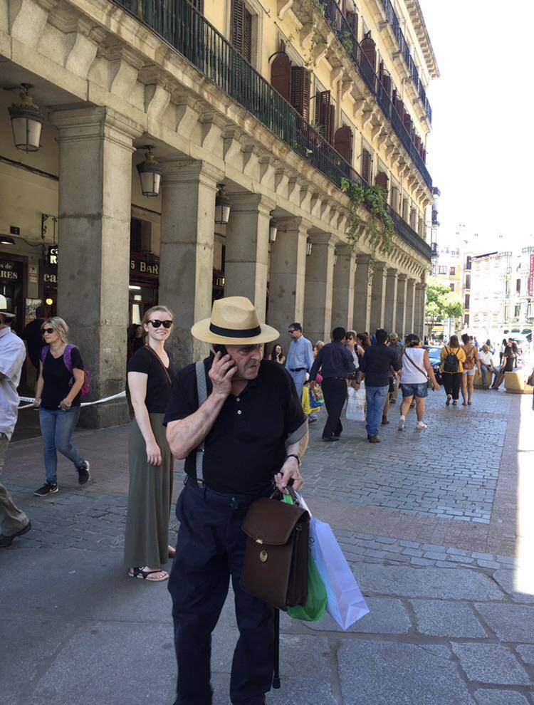 Man wearing a hat talking on the phone