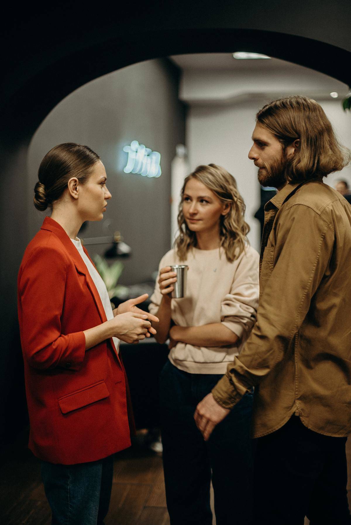 Three people talking at event