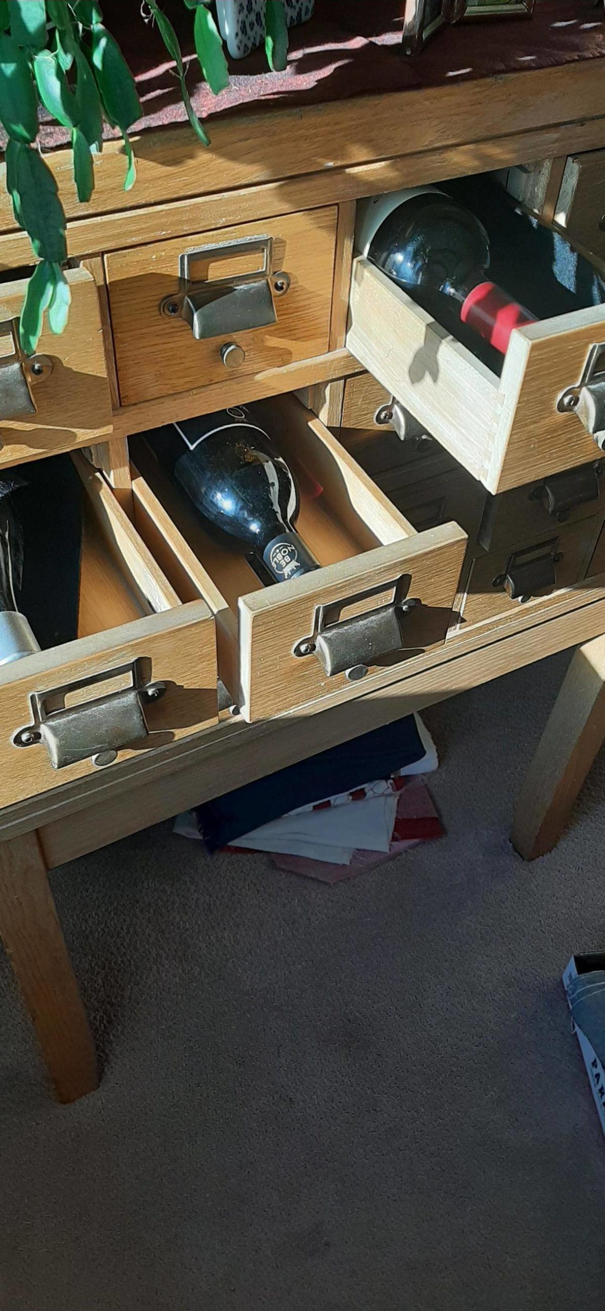 Recycled wooden card catalogue holder for wine bottles