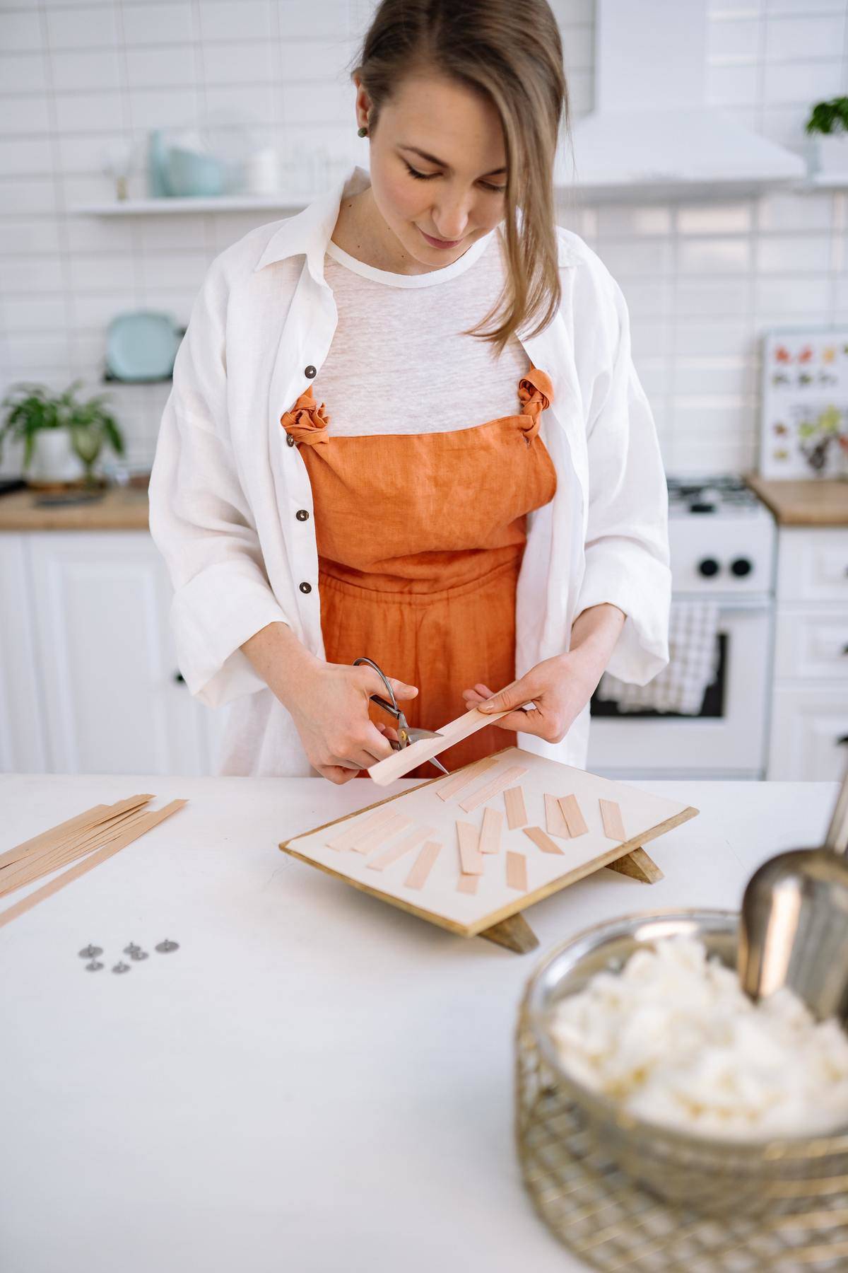 Woman working at crafting in her kitchen