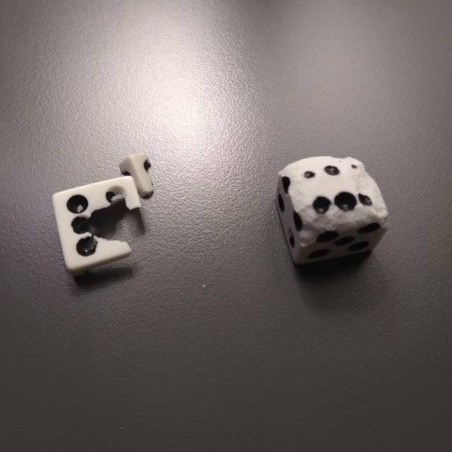 broken dice playing board game