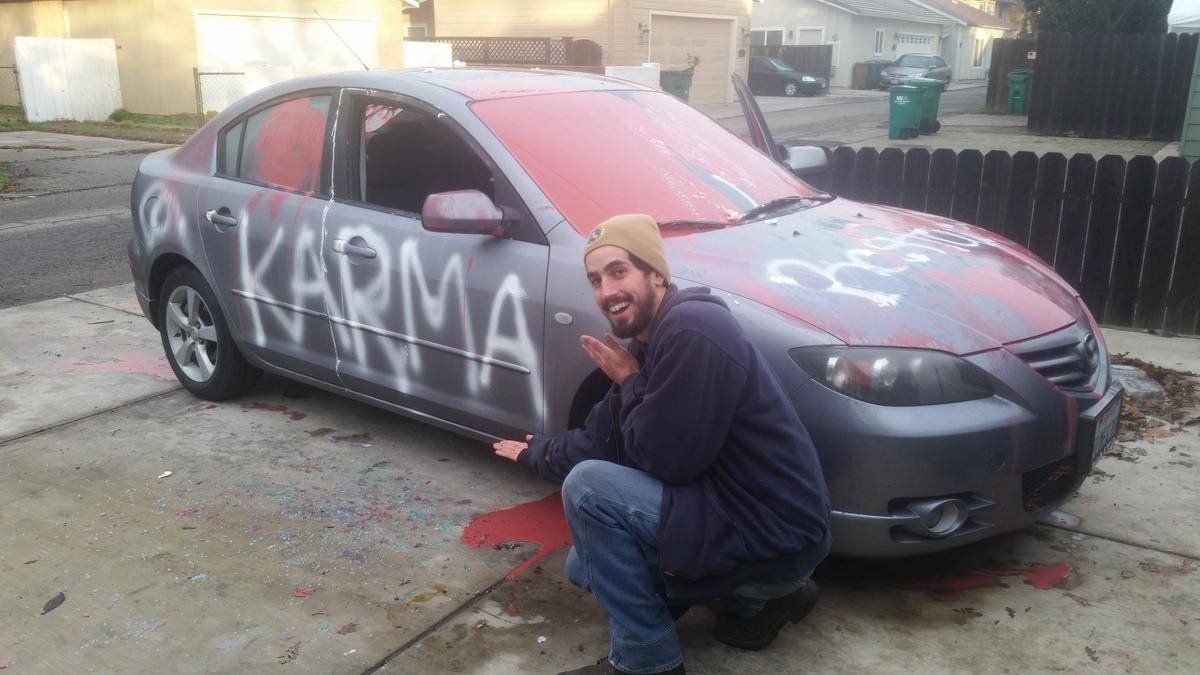 Car spray painted to say Karma
