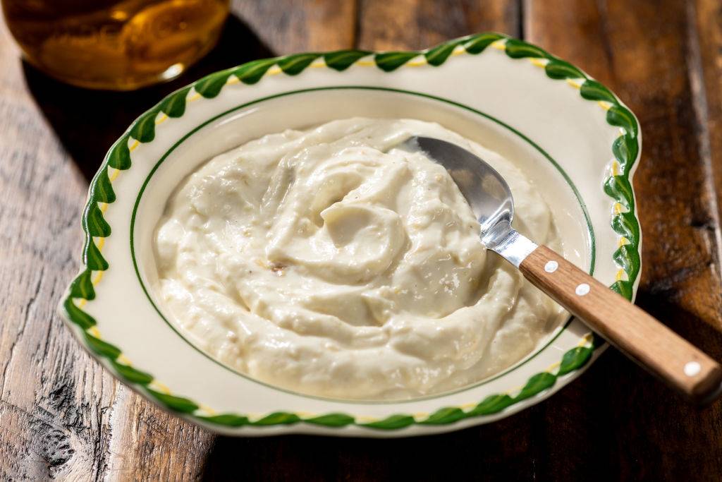 greek yogurt in a bowl with a spoon
