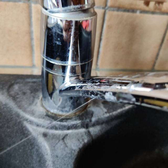 water squirting out of the faucet 
