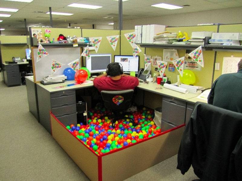 Cubicle with a ball pit in it.